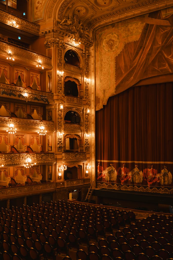Luxurious interior view of Teatro Colón showcasing ornate balconies and a grand stage.